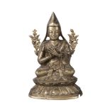 A Sino-Tibetan bronze figure of Tsongkhapa, 19th century, seated in Dhayasana, with detachable