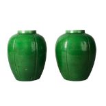 A pair of Chinese monochrome porcelain apple-green glazed lobed jars, Kangxi period, early 18th