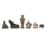 Six Chinese bronzes, 17th-19th century, comprising two scroll weights modelled as a buffalo, 8.5cm