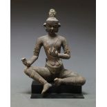 A large Nepalese clay Bodhisattva, 19th century, with right hand on knee, 38cm high