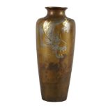 A Japanese bronze silver and gold inlaid vase, late Meiji period, decorated with a snarling