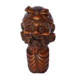 A Japanese carved wood bust of a bearded man, late 19th/early 20th century, with a ribbon tied top