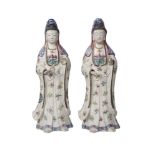 A pair of Chinese porcelain female figures, Qianlong period, painted in famille rose enamels with