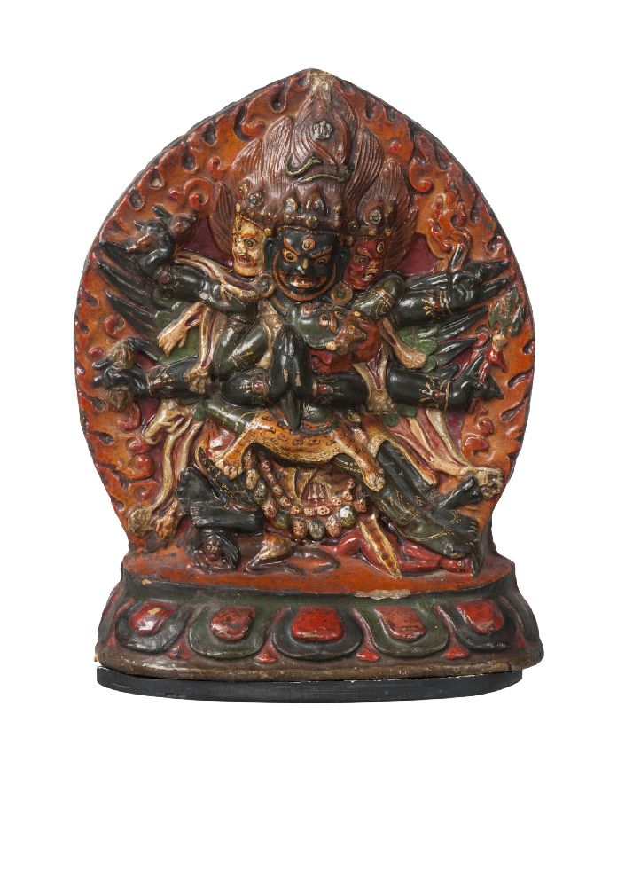 A large Tibetan painted terracotta votive plaque, 18th century, depicting Vajrakila with a flaming