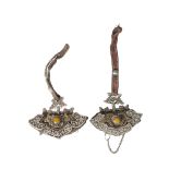 Two Tibetan gilt and white metal mounted leather tinder pouches, 19th century, each decorated with