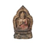 A Tibetan painted terracotta votive figure, 18th/19th century, depicting Tsongkhapa, 15cm high