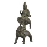 A Chinese bronze figure of Samantrabhadra on a lion, Song dynasty style, seated in lalitasana, the