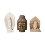 Three Chinese/South East Asian stone carvings, 20th century, comprising a gilded head of Buddha,