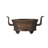 A Chinese bronze oval censer, 20th century, with archaistic handles and feet, apocryphal seal mark