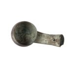 A Chinese bronze ritual ladle, Shang dynasty, the deep bowl with rounded sides, the stem cast with a
