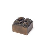 A Chinese bronzed square weight, 20th century, decorated to the top with two chi-long dragons, 5cm