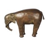 A Tibetan gilt copper alloy figure of an elephant, 19th century, standing four square, 15cm high,