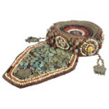 A Tibetan ceremonial hat, late 19th/early 20th century, profusely adorned with turquoise and other