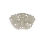 A Chinese pale green jade butterfly plaque, mid-19th century, reticulated, and with wings spread,