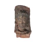 A Tibetan painted terracotta head of Shiva, 19th century, with later painted features, 25cm high