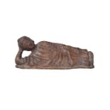 A Chinese terracotta figure of Shakyamuni Buddha, 19th century, modelled reclining with head