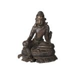 A Nepalese bronze figure of Tara, 12th-13th century, seated in lalitasana, her right hand in