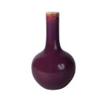 A Chinese porcelain pale aubergine glazed bottle vase, Qing dynasty, 18th century, with rich