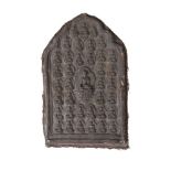 A large Tibetan terracotta votive plaque, 18th/19th century, depicting Shakyamuni Buddha, surrounded