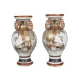 A pair of Japanese kutani porcelain baluster vases, early 20th century, the bodies painted with a