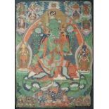 A large Tibetan thangka of Green Tara, 19th century, distemper on cloth, Tara seated in lalitasana