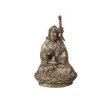 A Tibetan bronze figure of Padmasambhava, late 19th/early 20th century, seated on a lotus base,