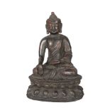 A Chinese bronze figure of Shakyamuni Buddha, Ming dynasty, 17th century, seated in dhayasana, on
