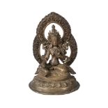 A Nepalese bronze figure of Tara, late 19th/early 20th century, seated in lalitasana, her palms
