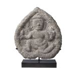 A South East Asian stone stele, 10th century, carved with a male deity, 26cm x 23cm
