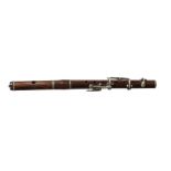 A rosewood fife or piccolo, 19th century, with metal fittings, 30cm longCONDITION REPORTsome light