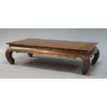 A Chinese stained hardwood low table, 20th Century, the rectangular top on curved legs, 41cm high