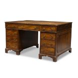 A Victorian mahogany partners desk, the rectangular top inset with gilt tooled leather writing