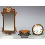 A George III style mahogany mirror, with a pierced gilt cresting in the form of a bird, flanked by