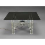 Philippe Jean, a lucite, chromed steel and smoked glass coffee table, c.1970s, the x frame lucite