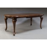 A Queen Anne style mahogany wind out dining table, early 20th Century, with two additional leaves,