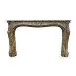 A large Louis XV style French fireplace, 19th century, in brown Pietralba marble, with a