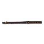 A rosewood fife or piccolo, 19th century, 39cm longCONDITION REPORTkey lost to end, losses to