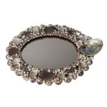 An oval shell encrusted mirror by Anthony Redmile, 20th century, with an abalone and coral cresting,