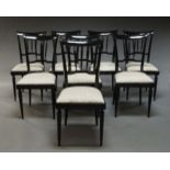 A set of eight Italian Art Deco style dining chairs, 20th Century, later painted black, with