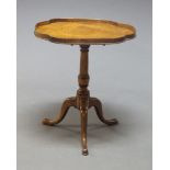 A Victorian mahogany tilt top occasional table, the shaped top above turned column to tripod legs