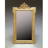 An English gilt composition Neoclassical style wall mirror, 19th century, with c scroll and shell