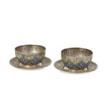 An unusual pair of enamelled engraved silver bowls and plates, Iran, 20th century, the bowls