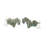 Two bronze finials in the form of horses heads, with saddles on their backs, Iran, 4.5cm high, on