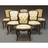 A set of six Louis XV style mahogany armchairs, early 20th Century, with cartouche shaped backs