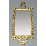 A Chippendale style giltwood wall mirror, late 19th, early 20th Century, of arched form with overall