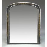 An ebonised and parcel gilt overmantel mirror, early 20th Century, of arched form with gilt floral