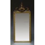 A French neoclassical giltwood pier mirror, late 19th, early 2oth Century, the pierced crest with