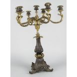 A Continental bronze and patinated metal seven light candelabra, late 19th/early 20th century, the