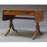 A Regency mahogany and crossbanded sofa table, the rectangular top with two drop leaves, above two