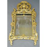 A French giltwood wall mirror, 19th Century, the pierced crest decorated with vase of flowers,